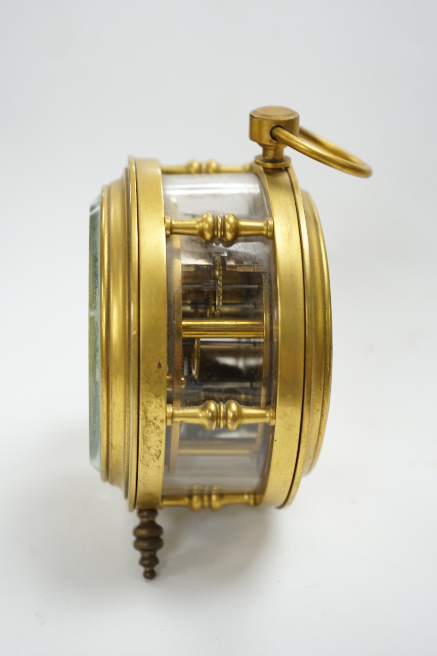 A late 19th century brass and glass drum shaped timepiece unusually with an English single fusee movement with platform lever escapement, 12.5cm high. Condition - good, unchecked if in working order